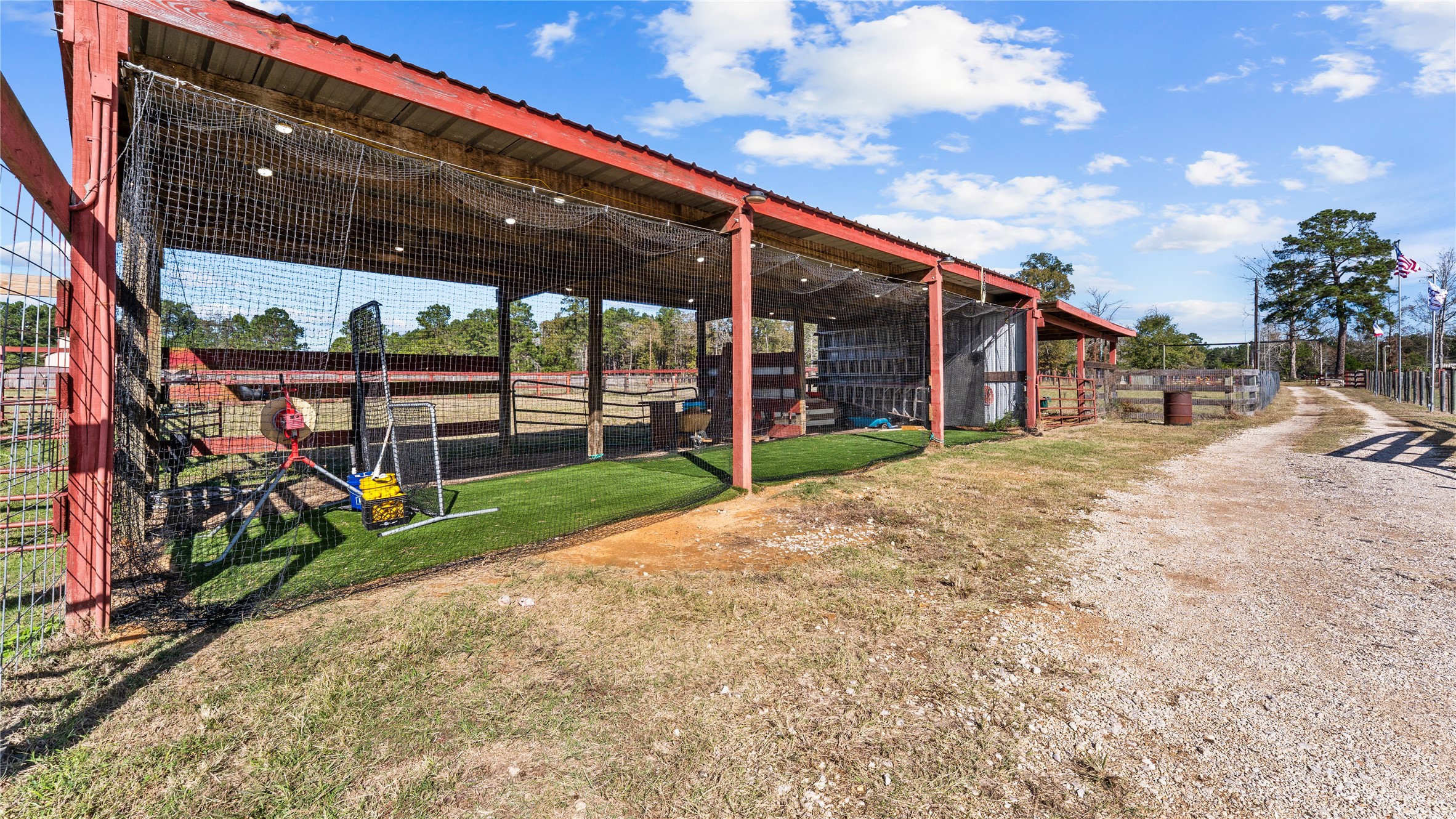 245 Alabama Point Livingston, TX 77351 - Photo 42 of 50 It's a fully lighted batting cage now but could be equipment storage instead.