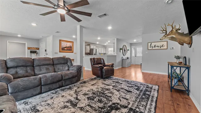 a view of a dining room with furniture and wooden floor