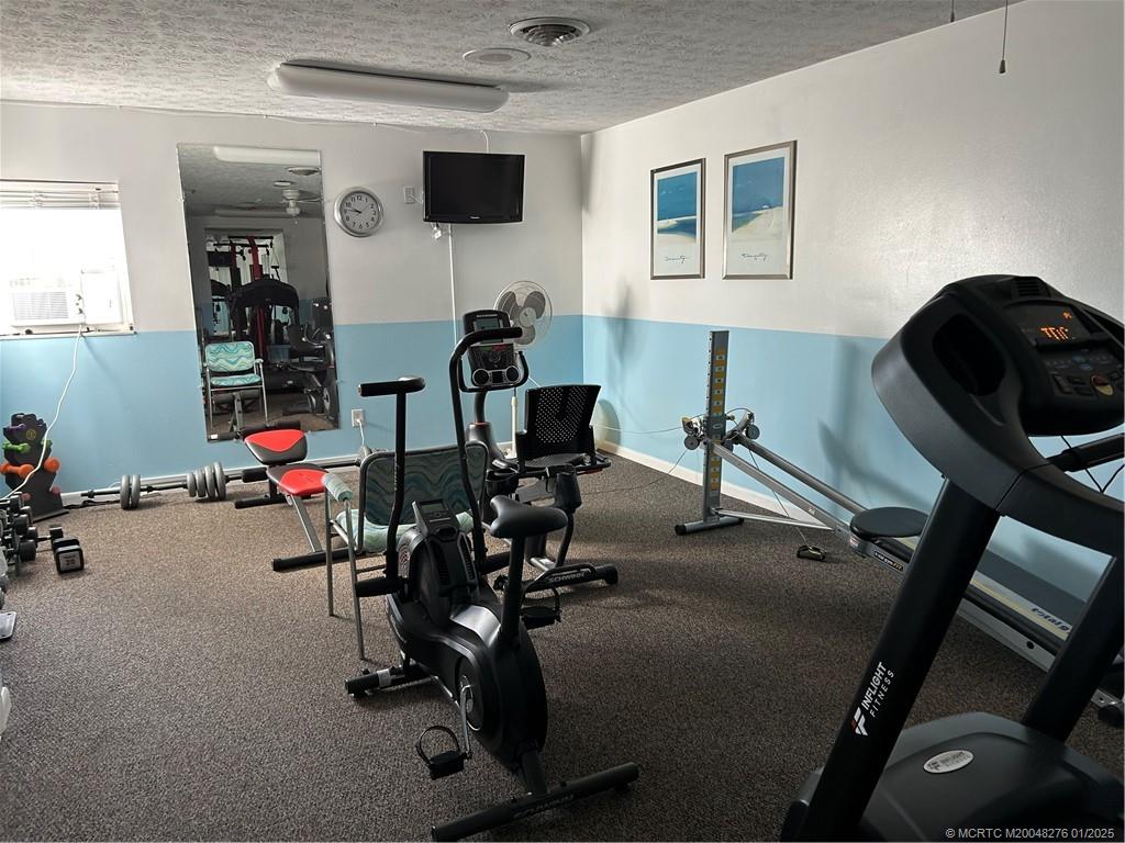 1997 Southwest Palm City Road, Unit 48H Stuart, FL 34994 - Photo 38 of 49 Exercise room
