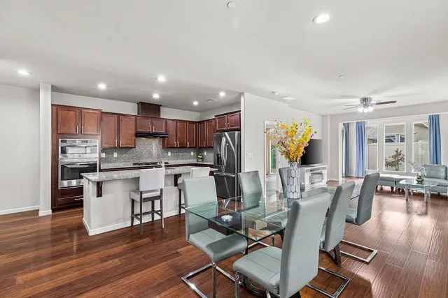 a view of kitchen with cabinets and wooden floor