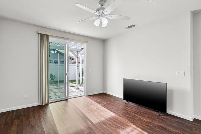 an aerial view of a residential houses with outdoor space and street view