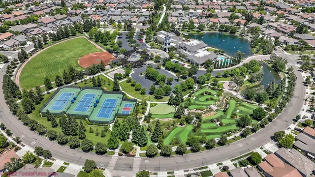 a bird view of multi story residential apartment building with yard