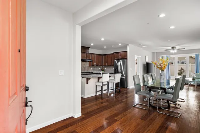 a kitchen with a table and chairs