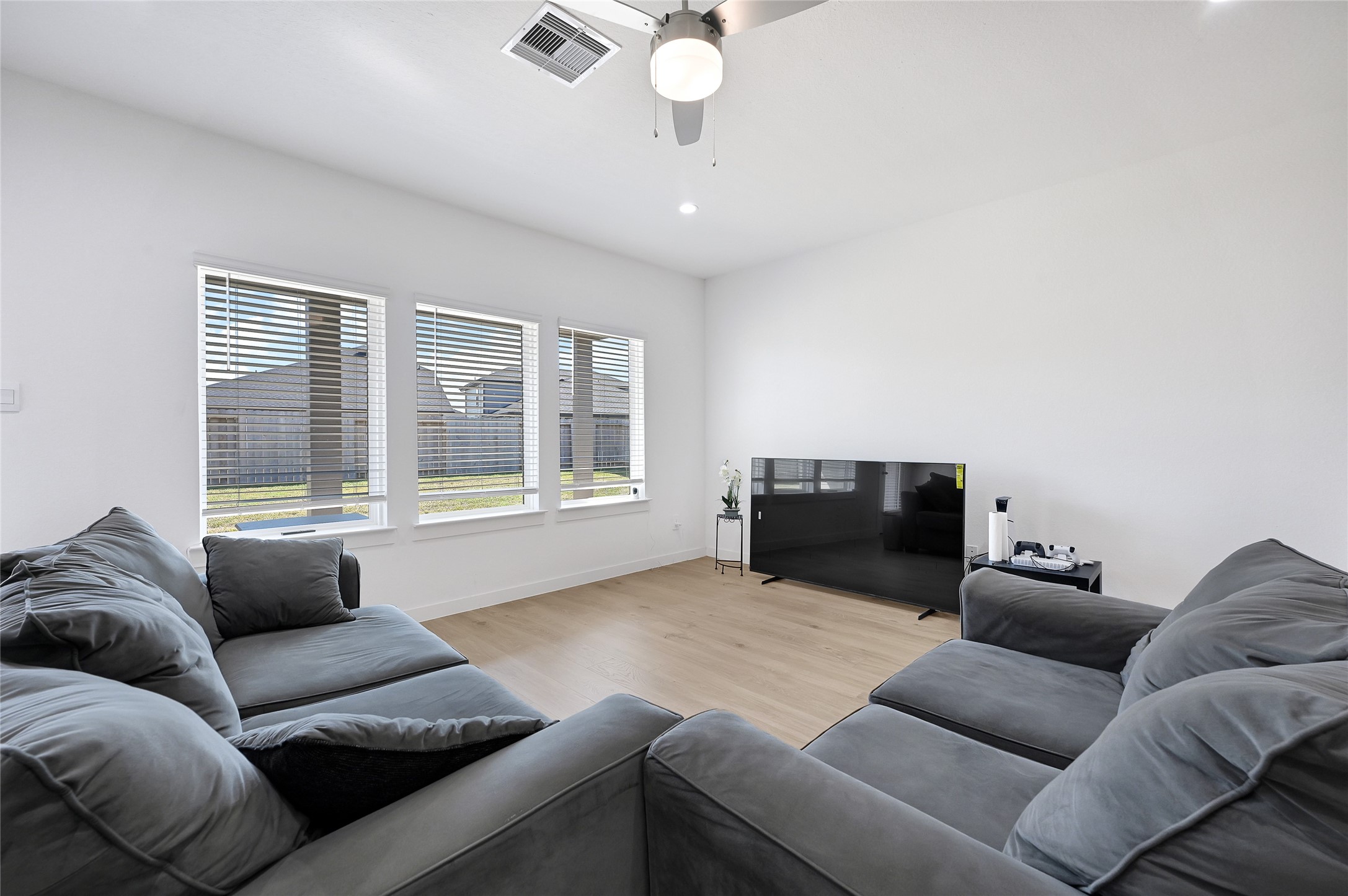 31703 Theodore Bend Drive Fulshear, TX 77441 - Photo 12 of 24 a living room with furniture and a window