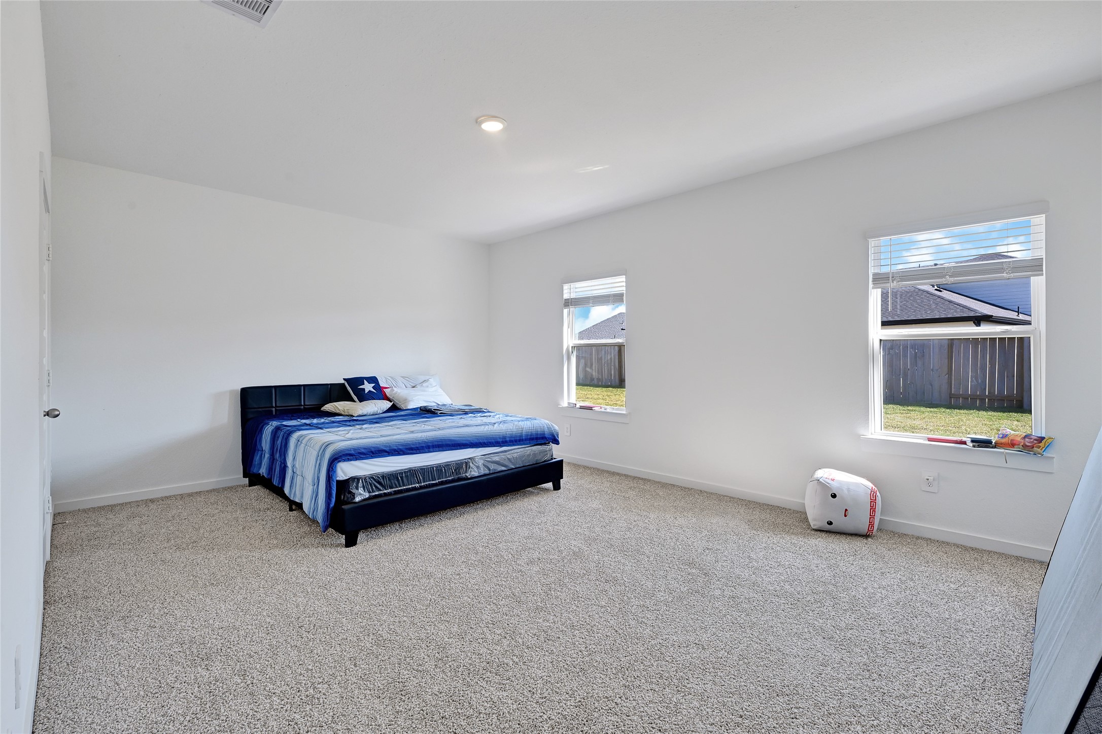 31703 Theodore Bend Drive Fulshear, TX 77441 - Photo 15 of 24 a bedroom with a bed and window