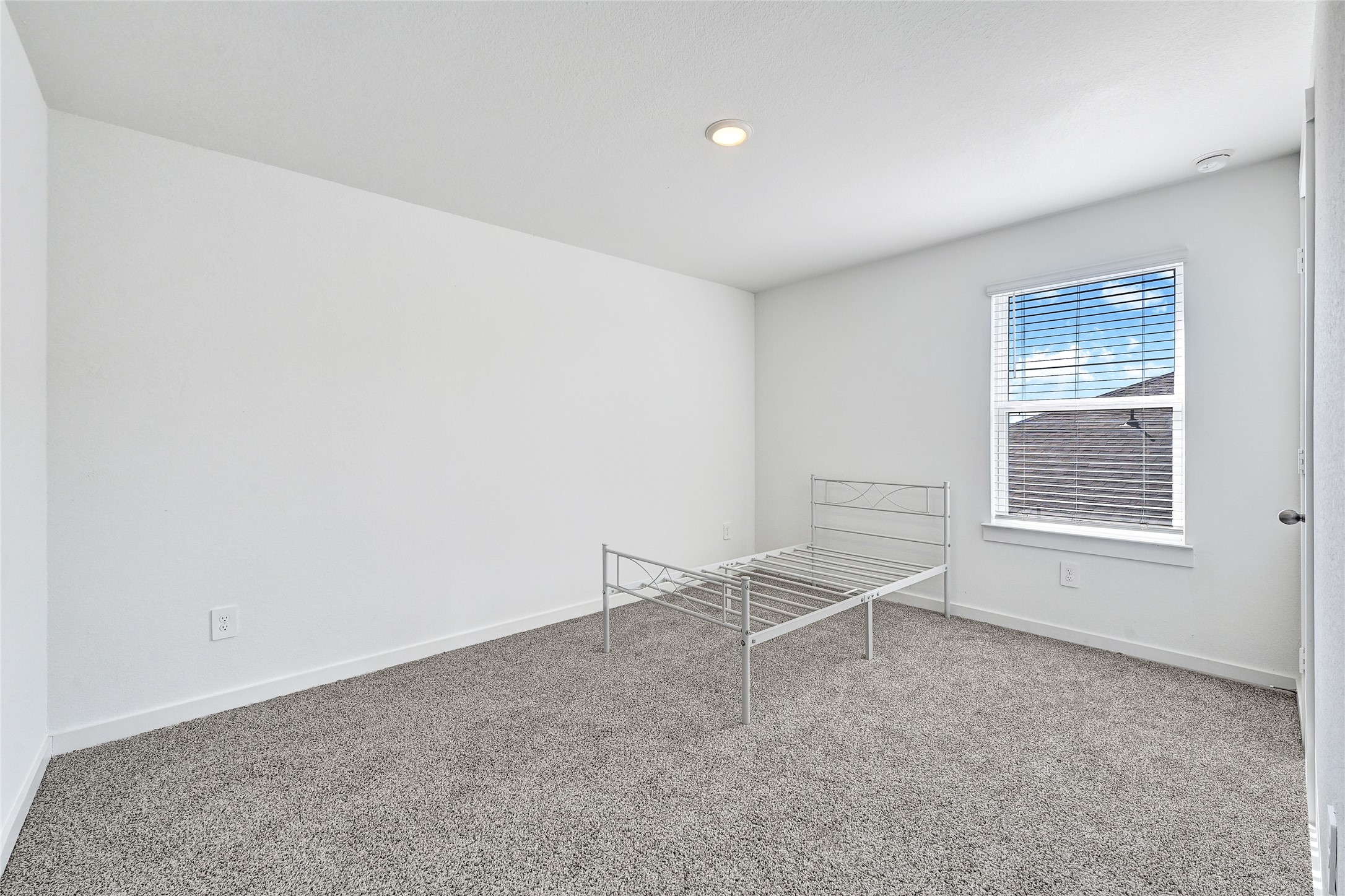 31703 Theodore Bend Drive Fulshear, TX 77441 - Photo 21 of 24 an empty room with windows