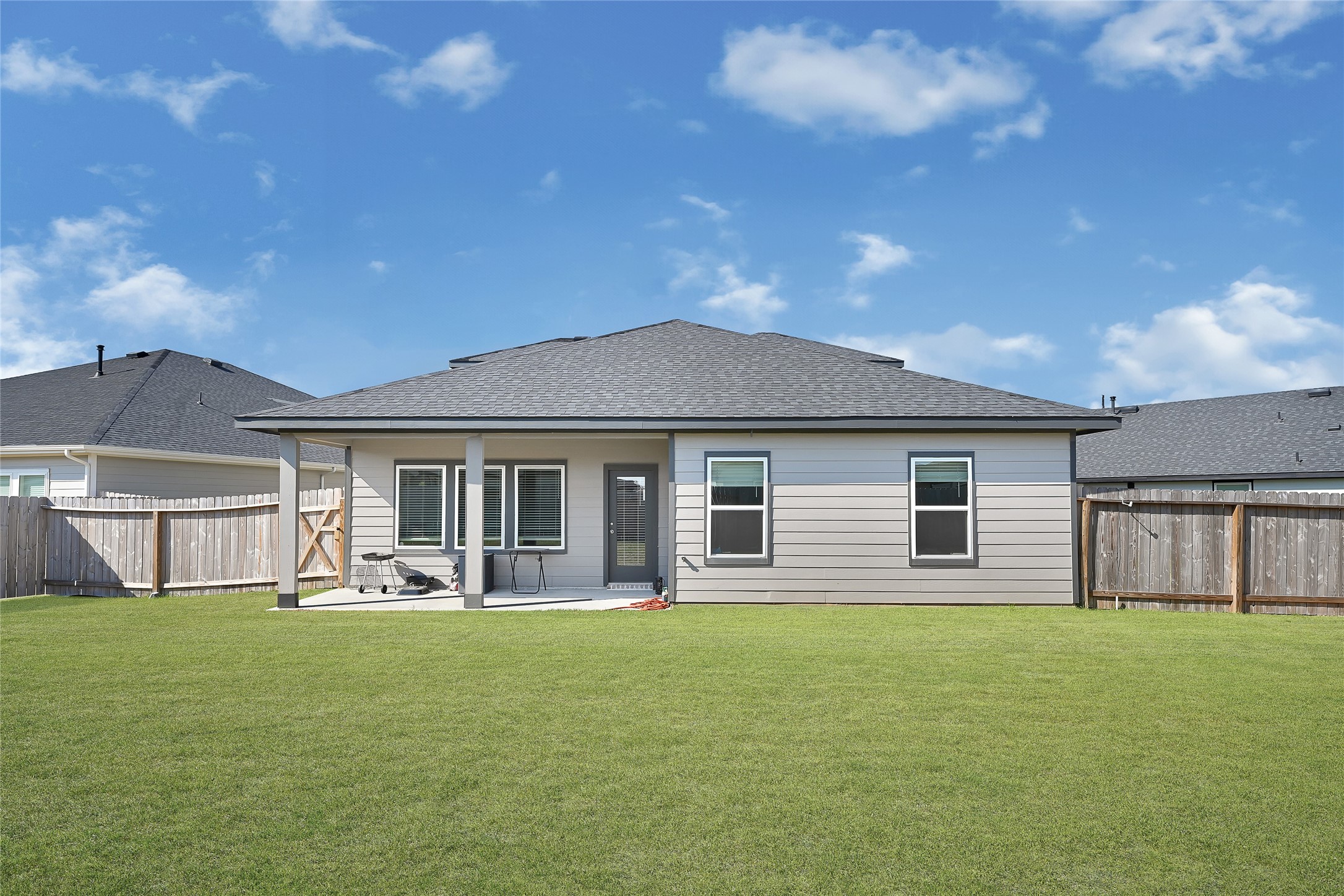 31703 Theodore Bend Drive Fulshear, TX 77441 - Photo 24 of 24 a front view of house with a garden and deck