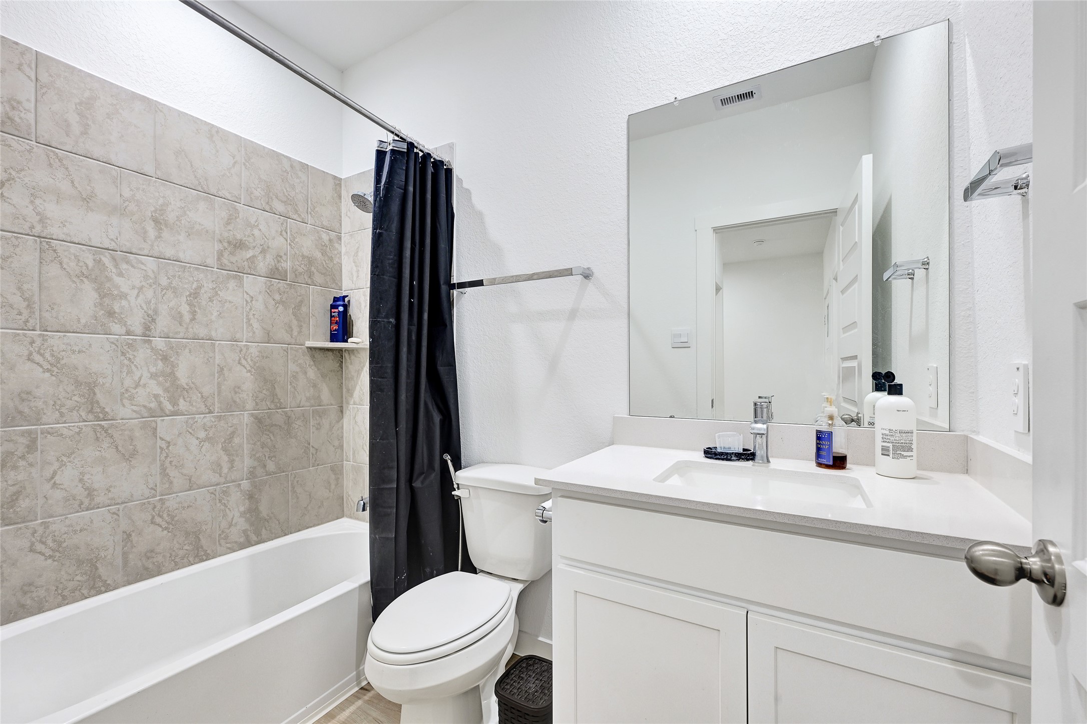 31703 Theodore Bend Drive Fulshear, TX 77441 - Photo 6 of 24 a bathroom with a sink toilet and shower