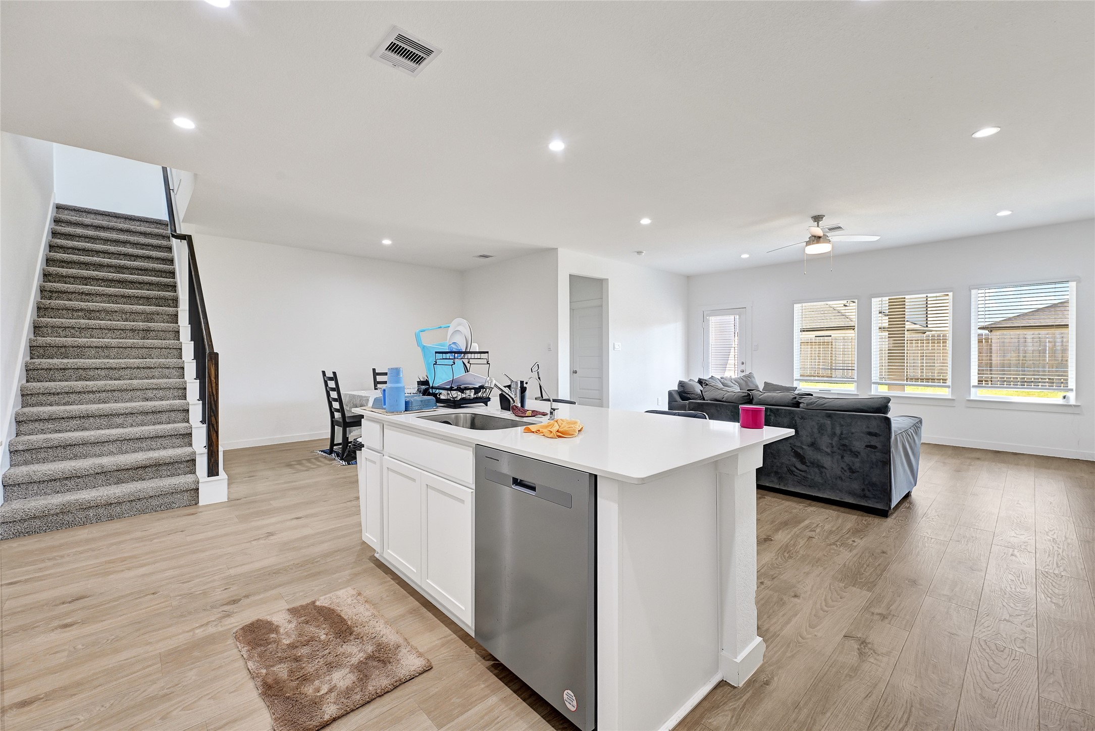 31703 Theodore Bend Drive Fulshear, TX 77441 - Photo 10 of 24 a kitchen with a sink and cabinets
