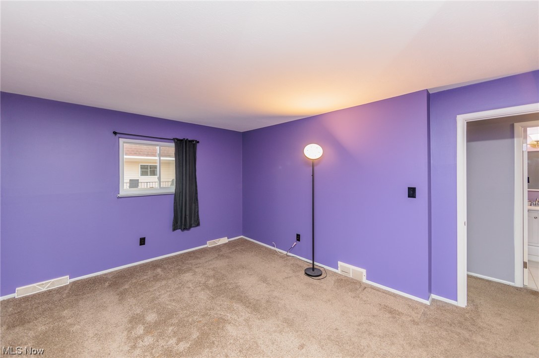 6472 State Road, Unit J19 Parma, OH 44134 - Photo 24 of 33 Unfurnished room with light colored carpet