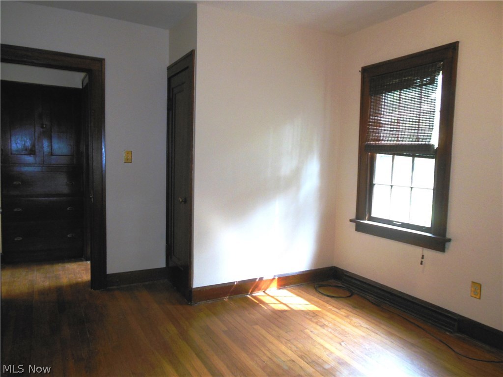 2129 Hubbard Road Madison, OH 44057 - Photo 14 of 27 "master" bedroom has hardwood floors, and beautiful woodwork....in the hall you can see the built ins, right off the bathroom which is conveniently located