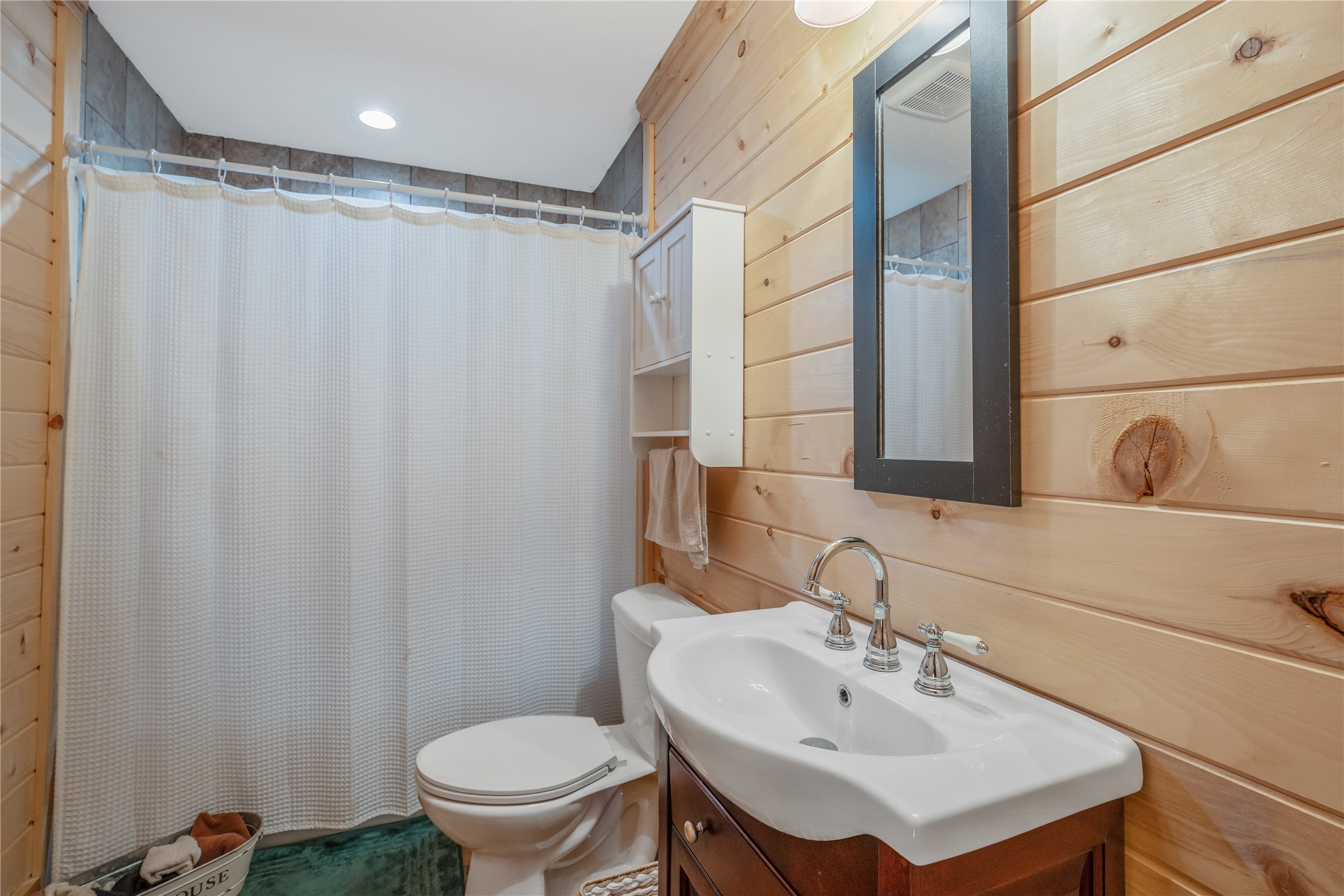 6751 County Road 4710 Larue, TX 75770 - Photo 19 of 47 a bathroom with a sink toilet and shower