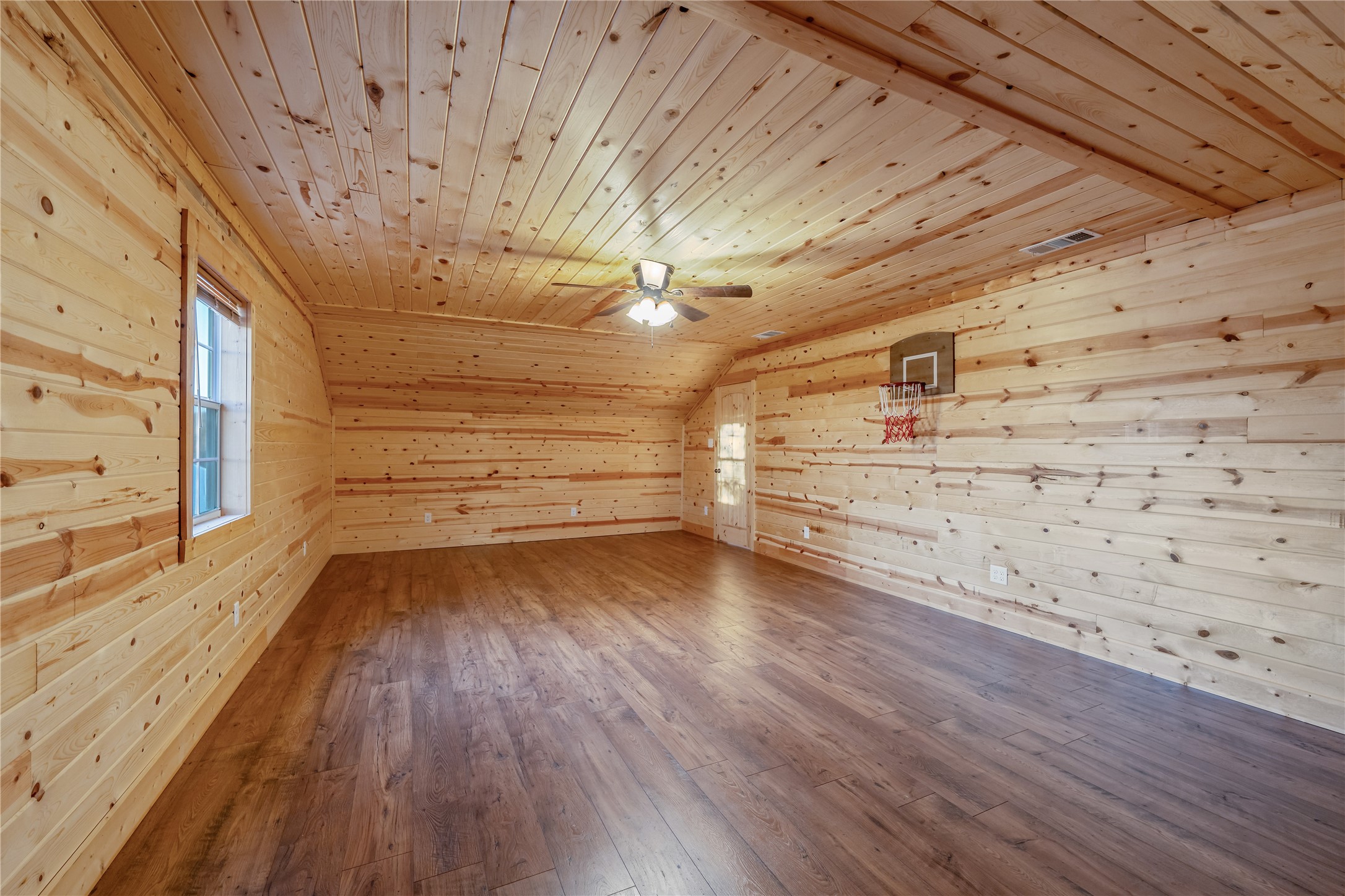 6751 County Road 4710 Larue, TX 75770 - Photo 23 of 47 a view of a room with wooden floors and led lights