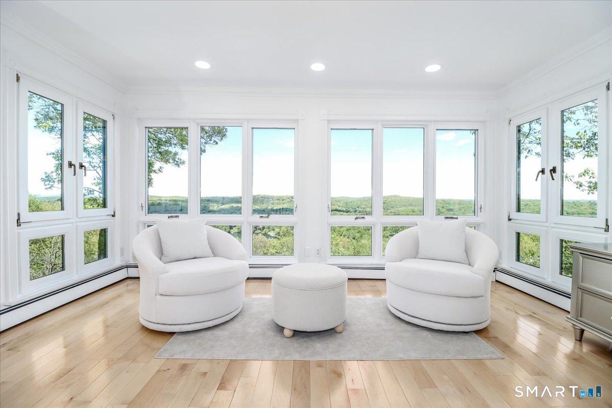 10 Hillcrest Court Ridgefield, CT 06877 - Photo 10 of 40 Formal Living Room. Sunlight floods the interiors through oversized windows.