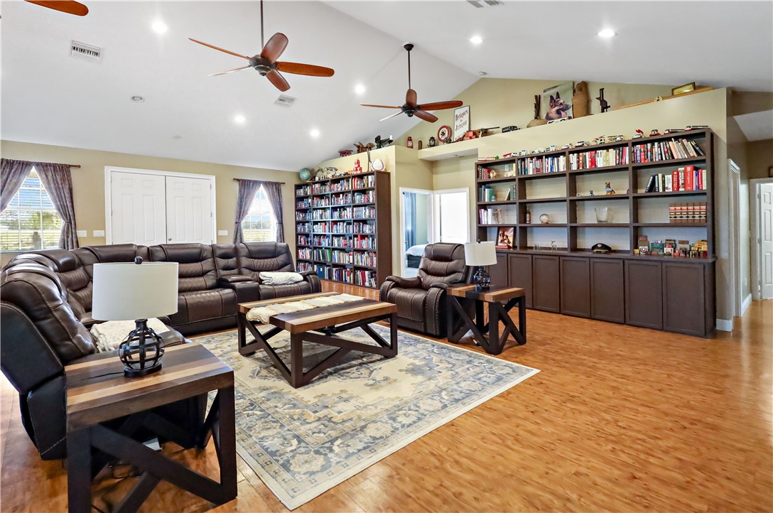 6045 21st Street Southwest Vero Beach, FL 32968 - Photo 14 of 36 a living room with furniture a rug and white walls