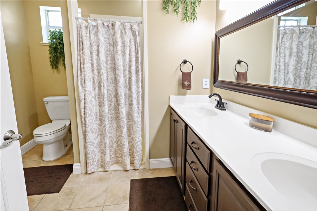 6045 21st Street Southwest Vero Beach, FL 32968 - Photo 17 of 36 a bathroom with a sink and a mirror