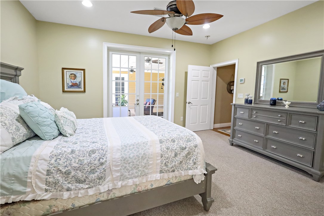 6045 21st Street Southwest Vero Beach, FL 32968 - Photo 20 of 36 a bedroom with a bed and a dresser