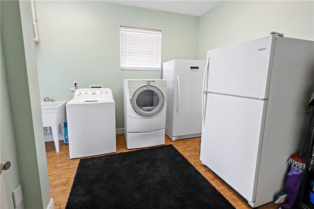 6045 21st Street Southwest Vero Beach, FL 32968 - Photo 22 of 36 a utility room with dryer and washer