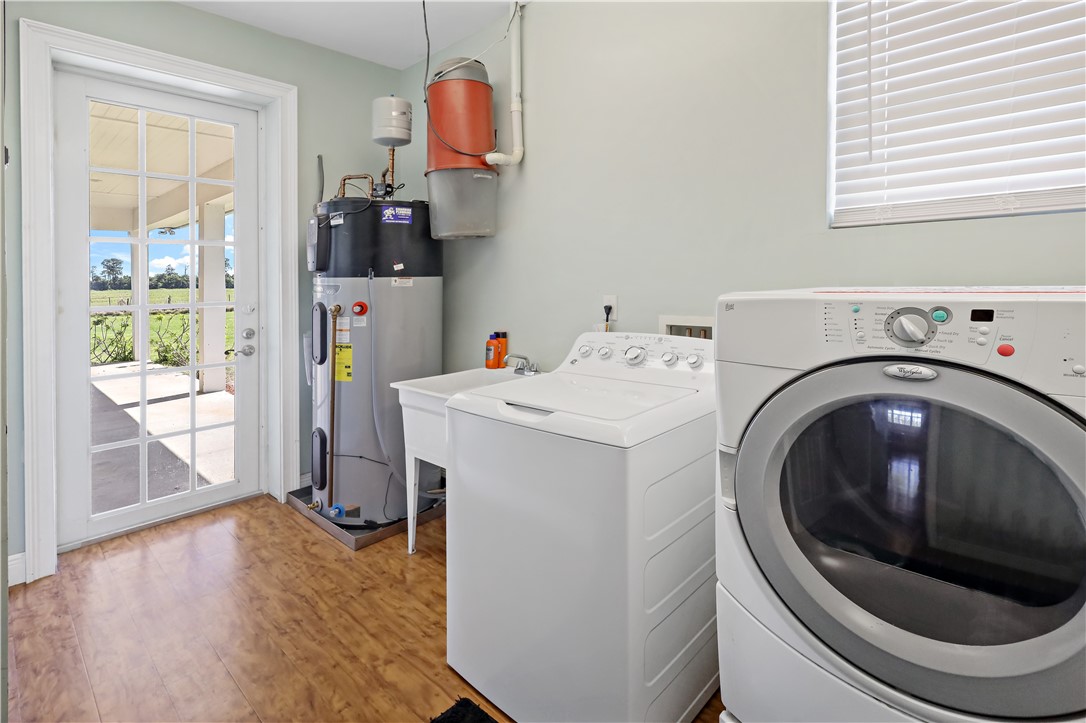 6045 21st Street Southwest Vero Beach, FL 32968 - Photo 23 of 36 a utility room with dryer and washer