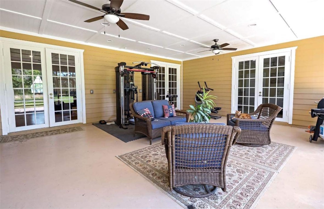 6045 21st Street Southwest Vero Beach, FL 32968 - Photo 32 of 36 a living room with furniture and windows