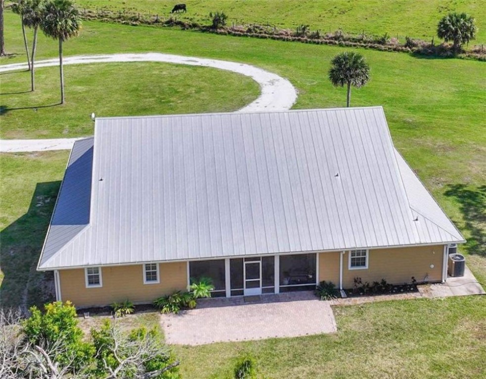 6045 21st Street Southwest Vero Beach, FL 32968 - Photo 36 of 36 a aerial view of a house with a yard and lake view