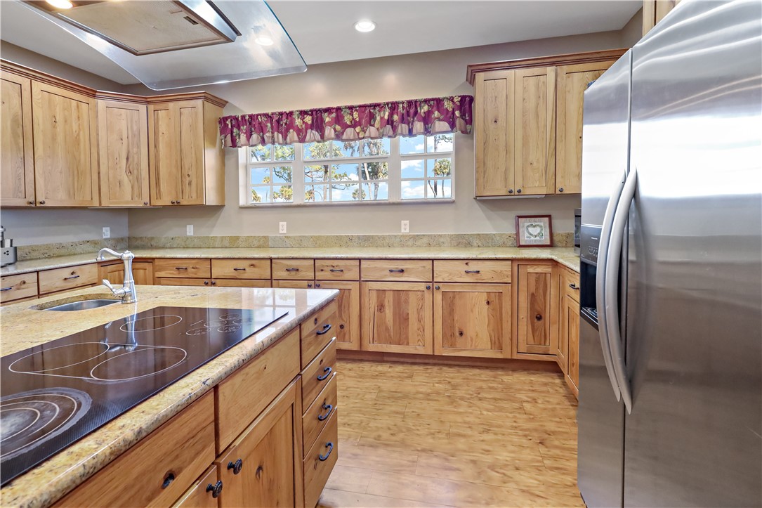 6045 21st Street Southwest Vero Beach, FL 32968 - Photo 9 of 36 a kitchen with stainless steel appliances granite countertop a sink stove and refrigerator