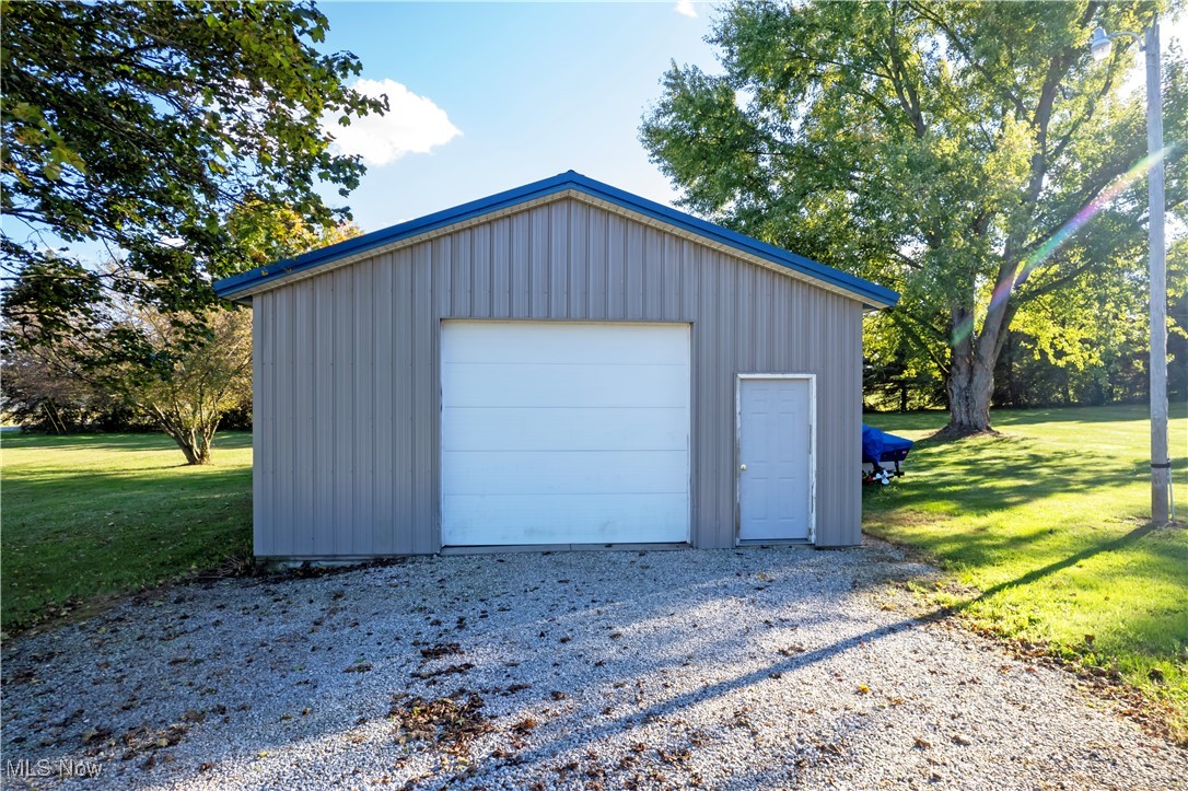 1675 South Funk Road Wooster, OH 44691 - Photo 2 of 34 Garage with wood walls and a yard