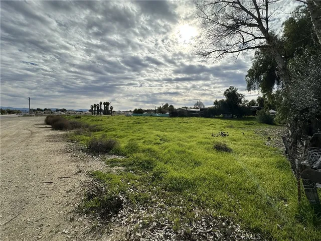 a view of a field with an trees