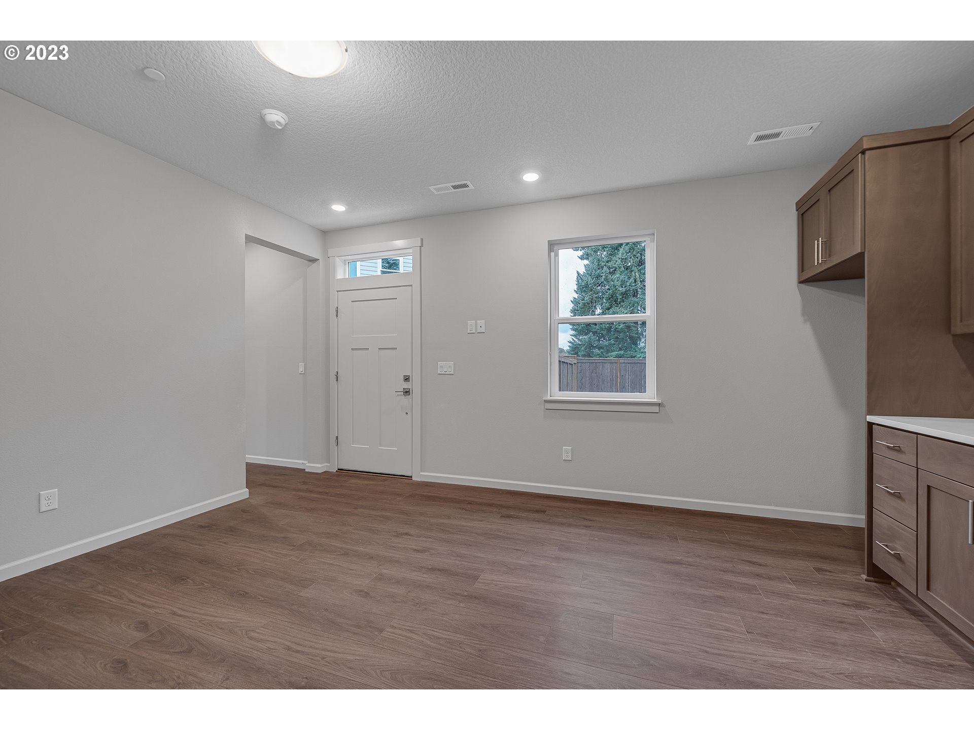 2609 South 4th Way Ridgefield, WA 98642 - Photo 20 of 25 a view of an empty room with wooden floor and a window