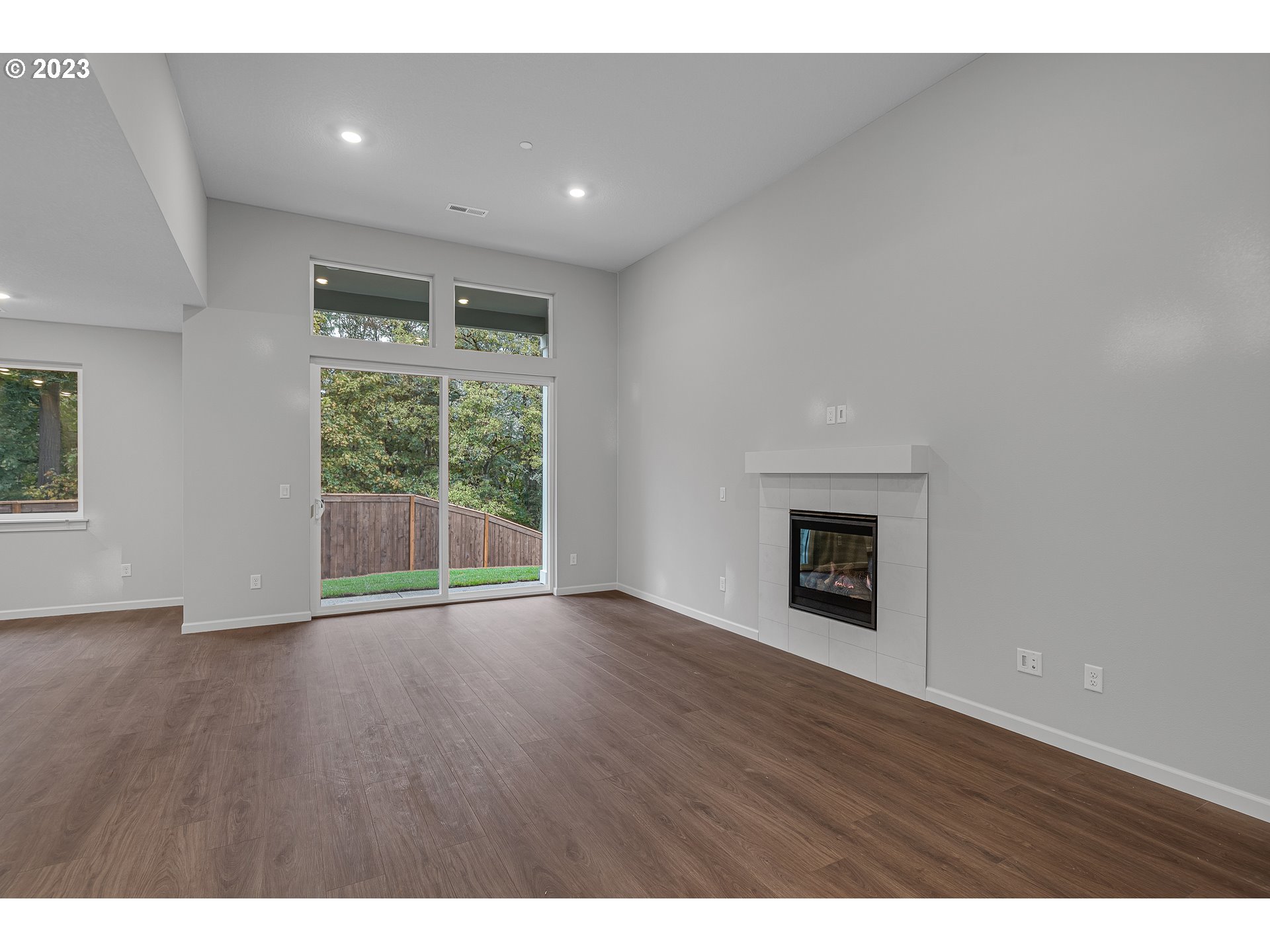 2609 South 4th Way Ridgefield, WA 98642 - Photo 5 of 25 a view of an empty room with wooden floor and a window