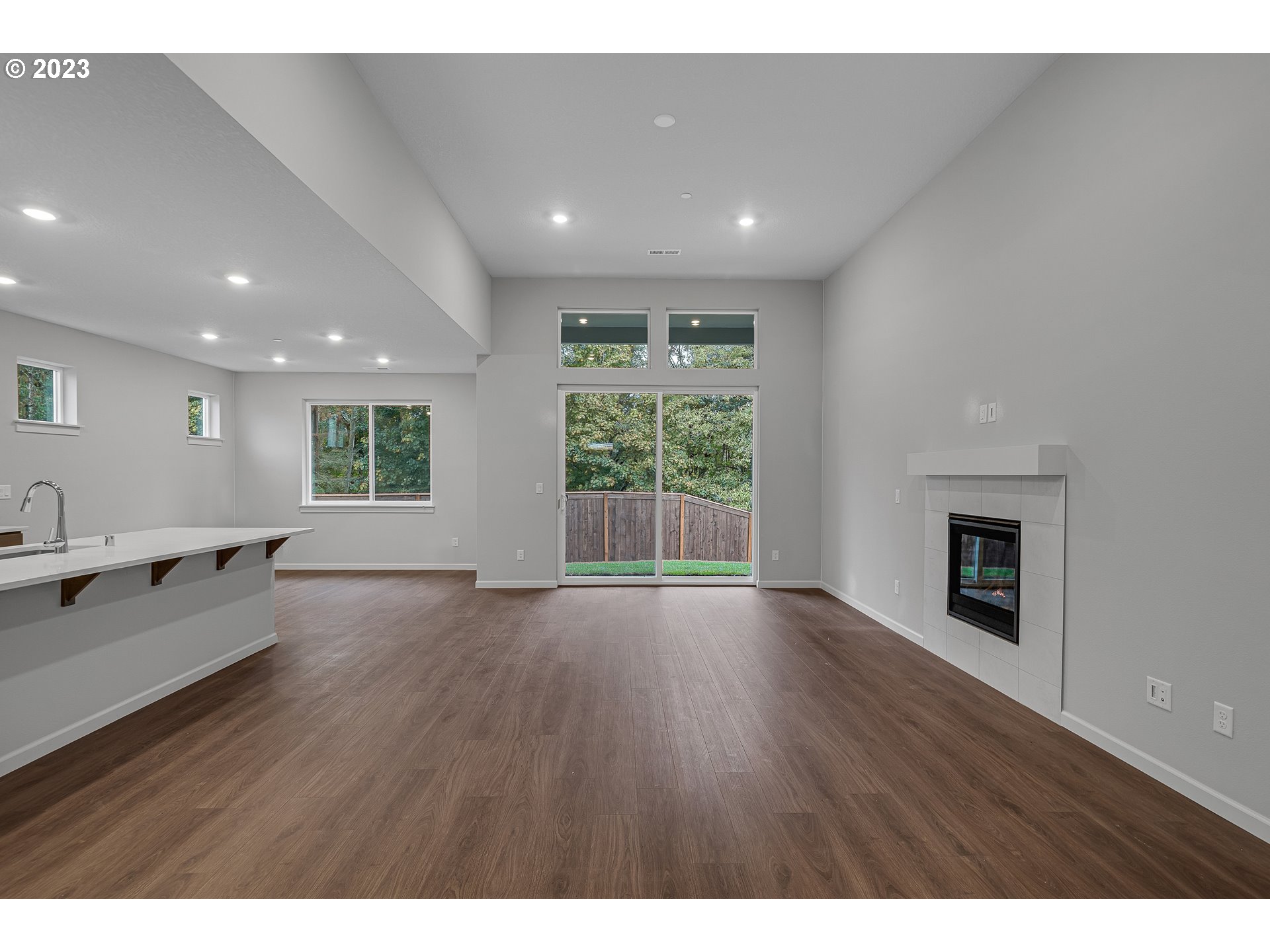2609 South 4th Way Ridgefield, WA 98642 - Photo 6 of 25 a view of an empty room with wooden floor and a window