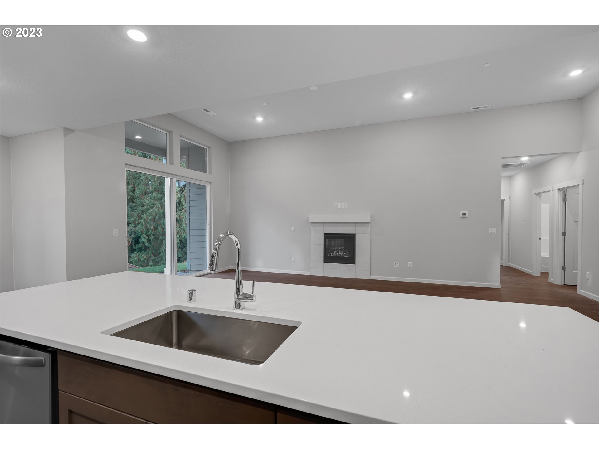 2609 South 4th Way Ridgefield, WA 98642 - Photo 9 of 25 a kitchen with a sink and a refrigerator
