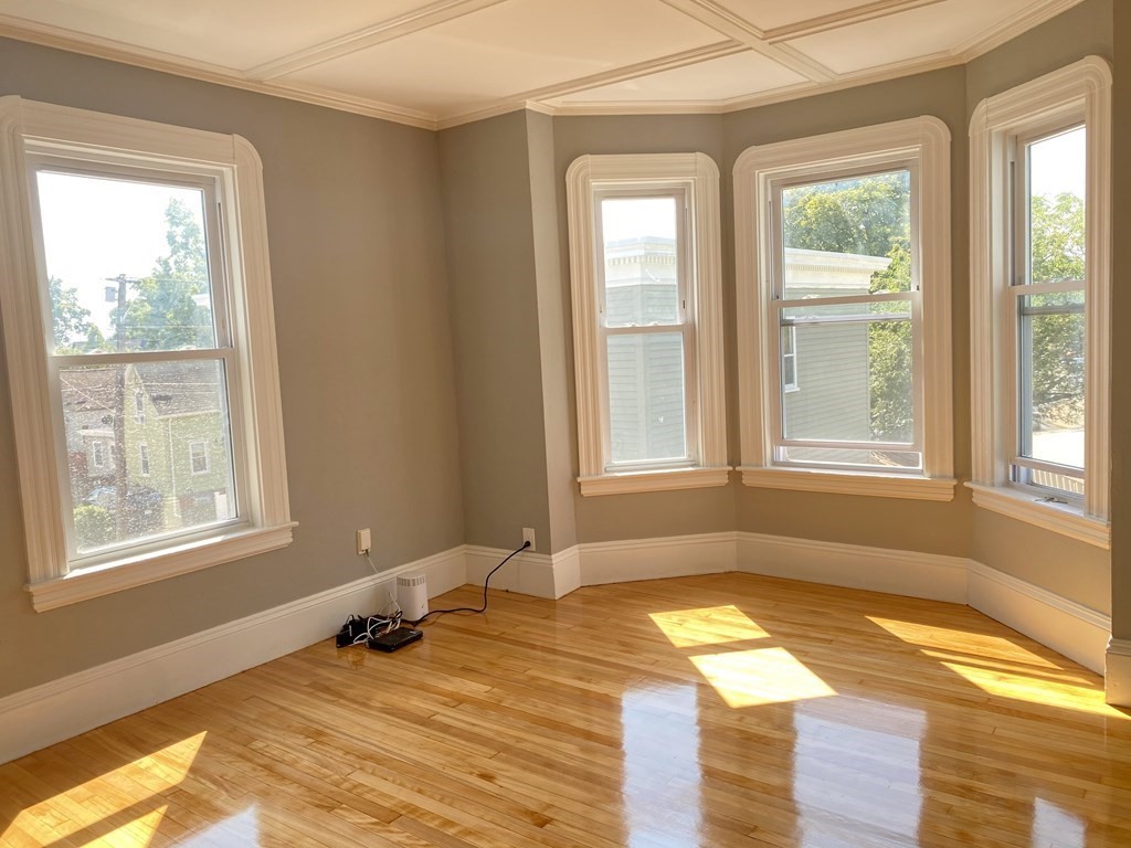 51 Walnut Street Lynn, MA 01905 - Photo 13 of 37 a view of a room with a window and wooden floor