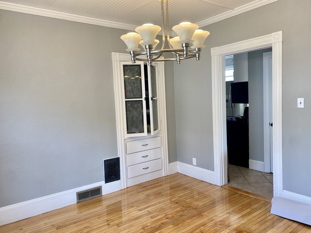 51 Walnut Street Lynn, MA 01905 - Photo 17 of 37 a view of a livingroom with a chandelier fan