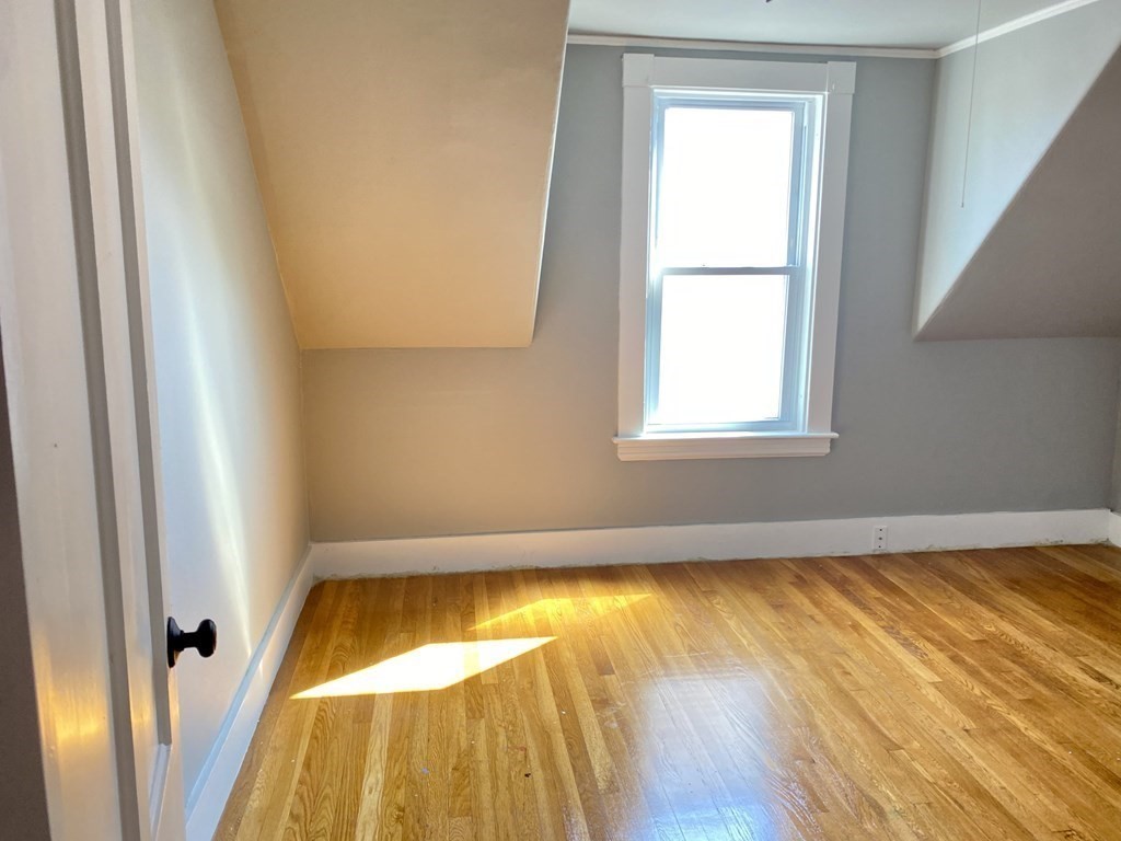 51 Walnut Street Lynn, MA 01905 - Photo 26 of 37 a view of a room with wooden floor and small window