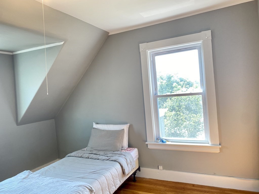 51 Walnut Street Lynn, MA 01905 - Photo 27 of 37 a bedroom with a bed and a window