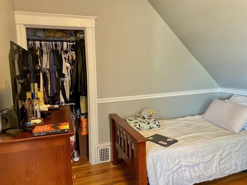 51 Walnut Street Lynn, MA 01905 - Photo 29 of 37 a bedroom with a bed and a dresser