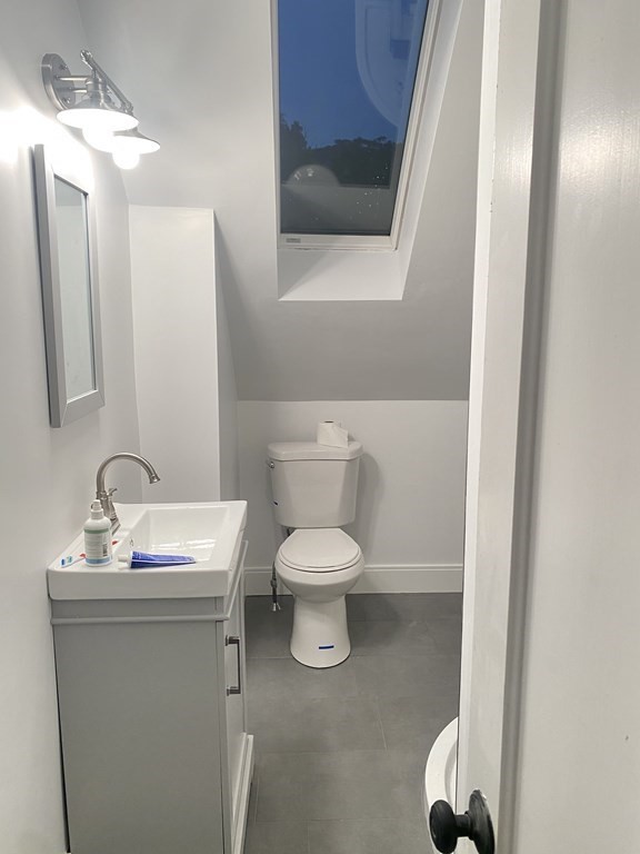 51 Walnut Street Lynn, MA 01905 - Photo 30 of 37 a bathroom with a toilet sink and mirror