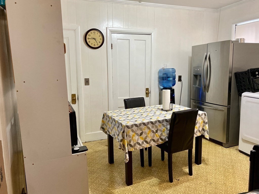 51 Walnut Street Lynn, MA 01905 - Photo 35 of 37 a dining table with a refrigerator freezer and a table