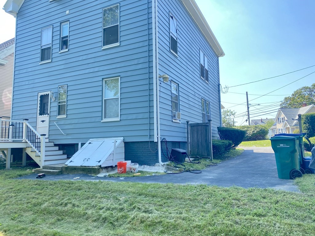 51 Walnut Street Lynn, MA 01905 - Photo 7 of 37 a view of a backyard with a garden