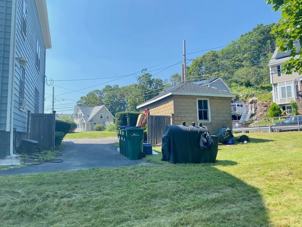 51 Walnut Street Lynn, MA 01905 - Photo 8 of 37 a view of a house with backyard sitting area and swimming pool
