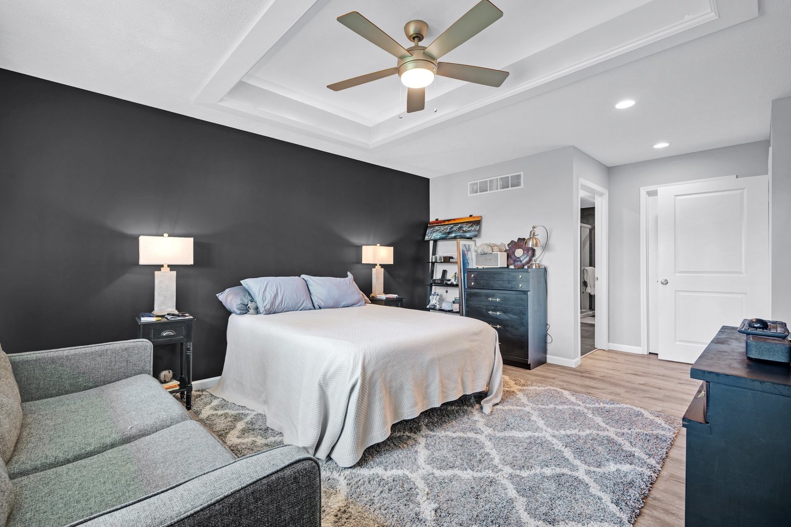 277 Cassidy Road Normal, IL 61761 - Photo 14 of 42 a bedroom with a bed and a chandelier