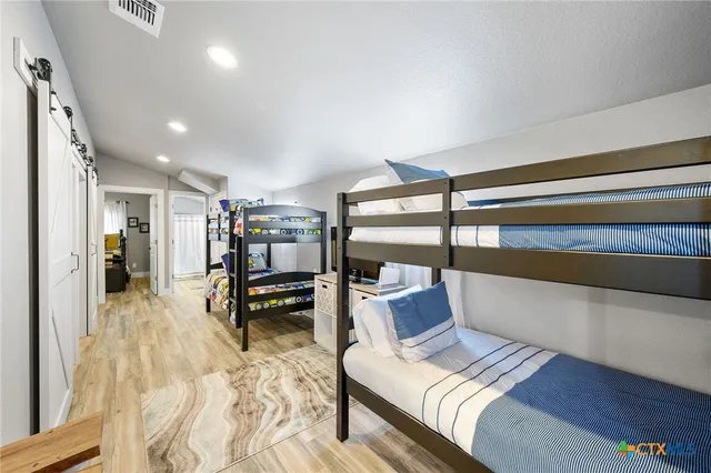 a bedroom with a bed and a table