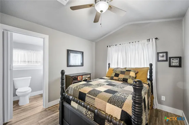 a view of dirt yard with a tree