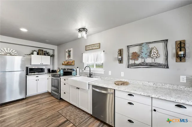 a bedroom with furniture and a book shelf