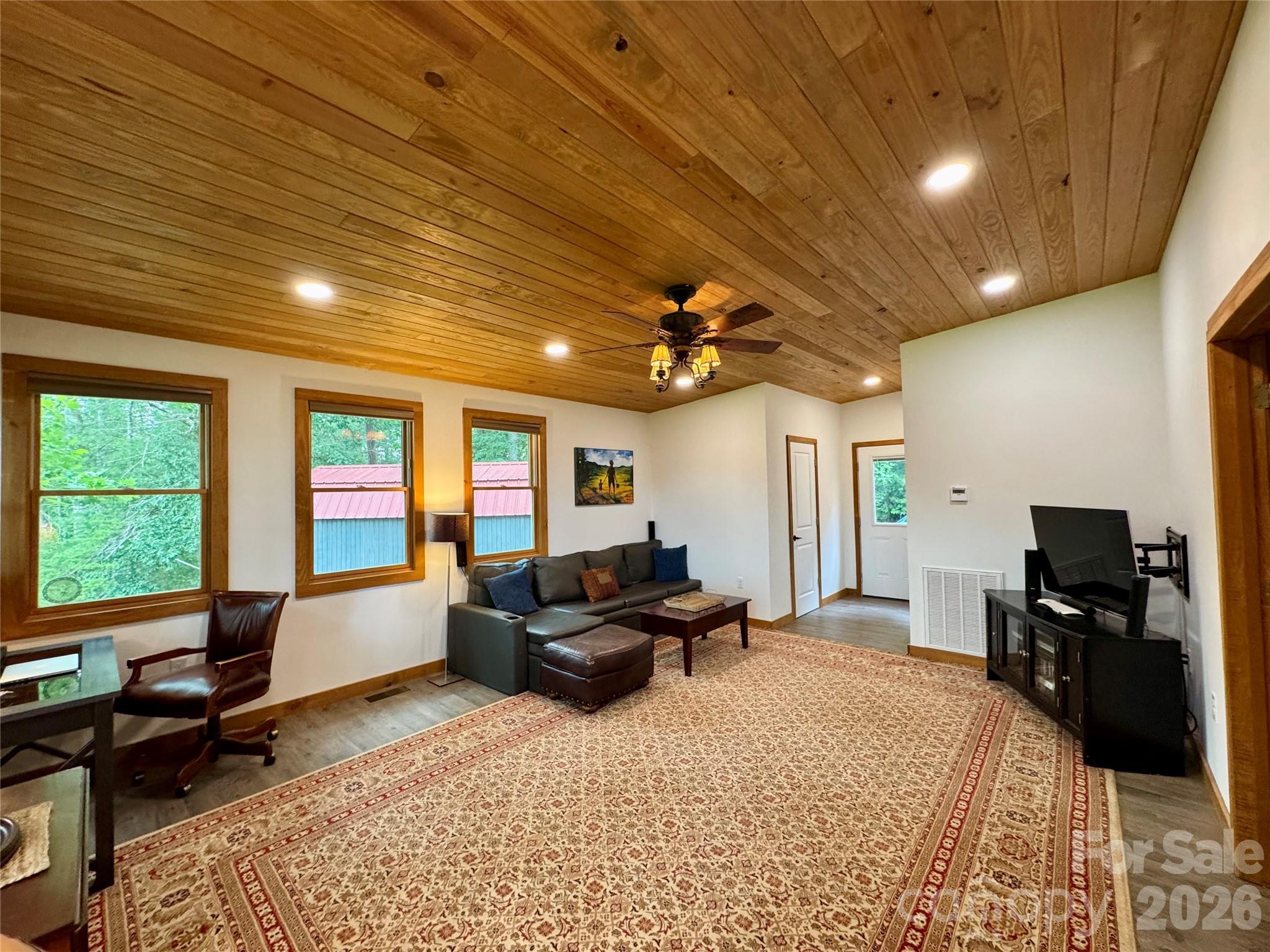 282 Calhoun Trail Rutherfordton, NC 28139 - Photo 23 of 48 a living room with furniture and a flat screen tv