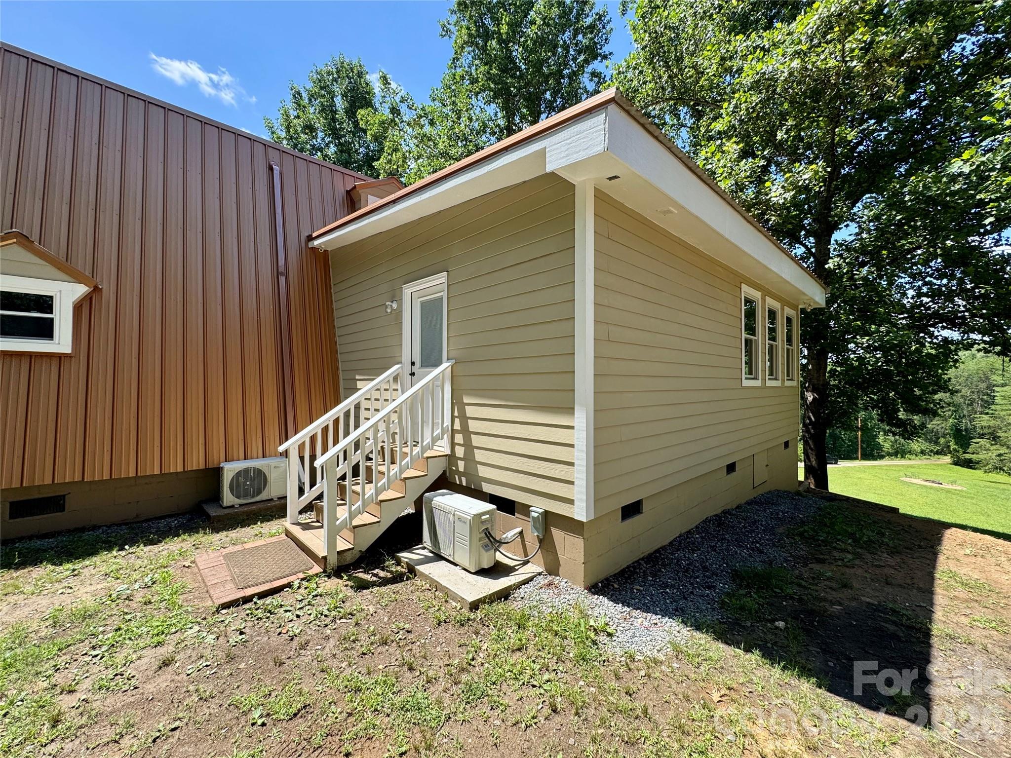 282 Calhoun Trail Rutherfordton, NC 28139 - Photo 40 of 48 a view of a house with backyard and sitting area