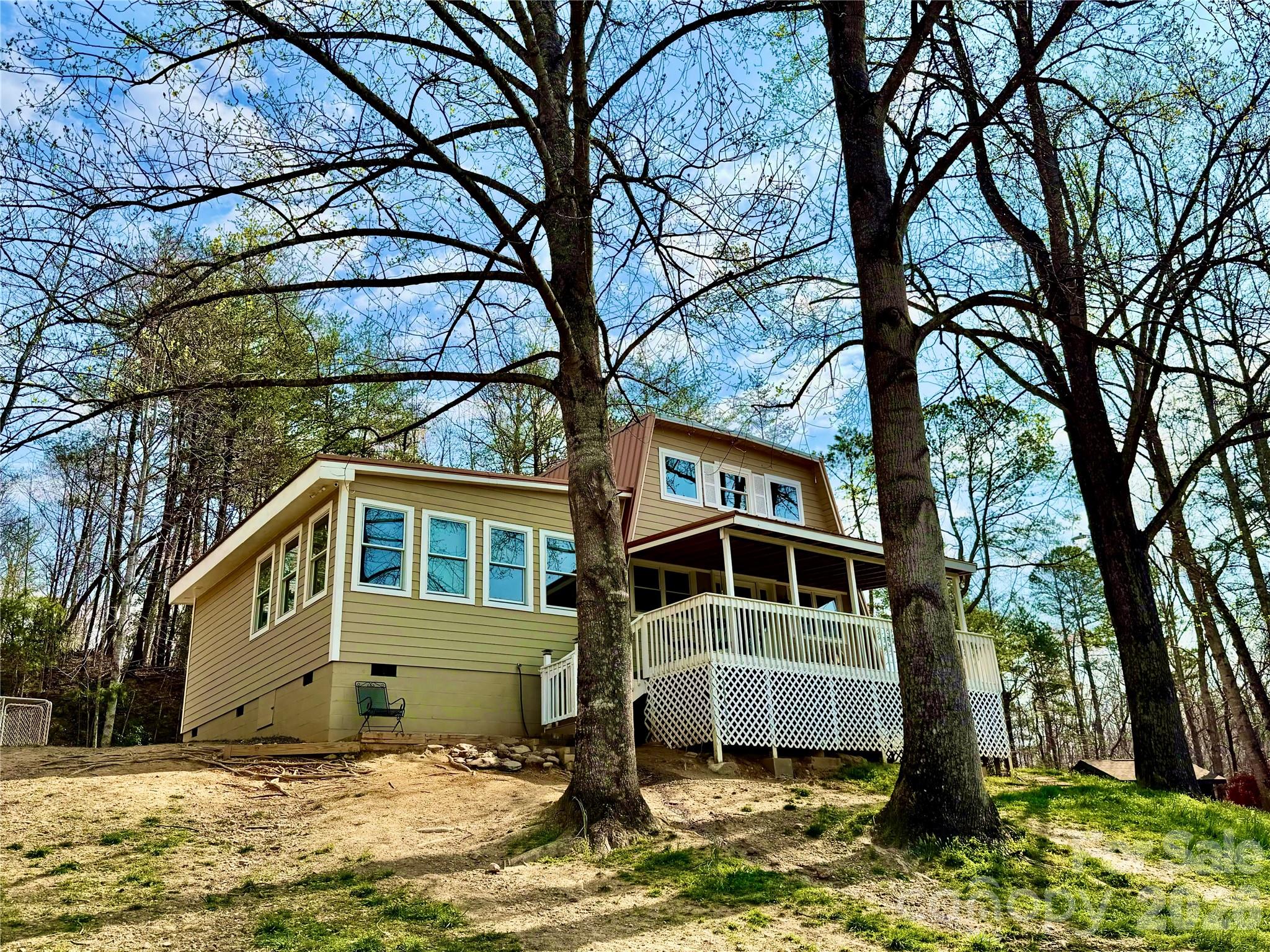 282 Calhoun Trail Rutherfordton, NC 28139 - Photo 4 of 48 a house with trees in front of it
