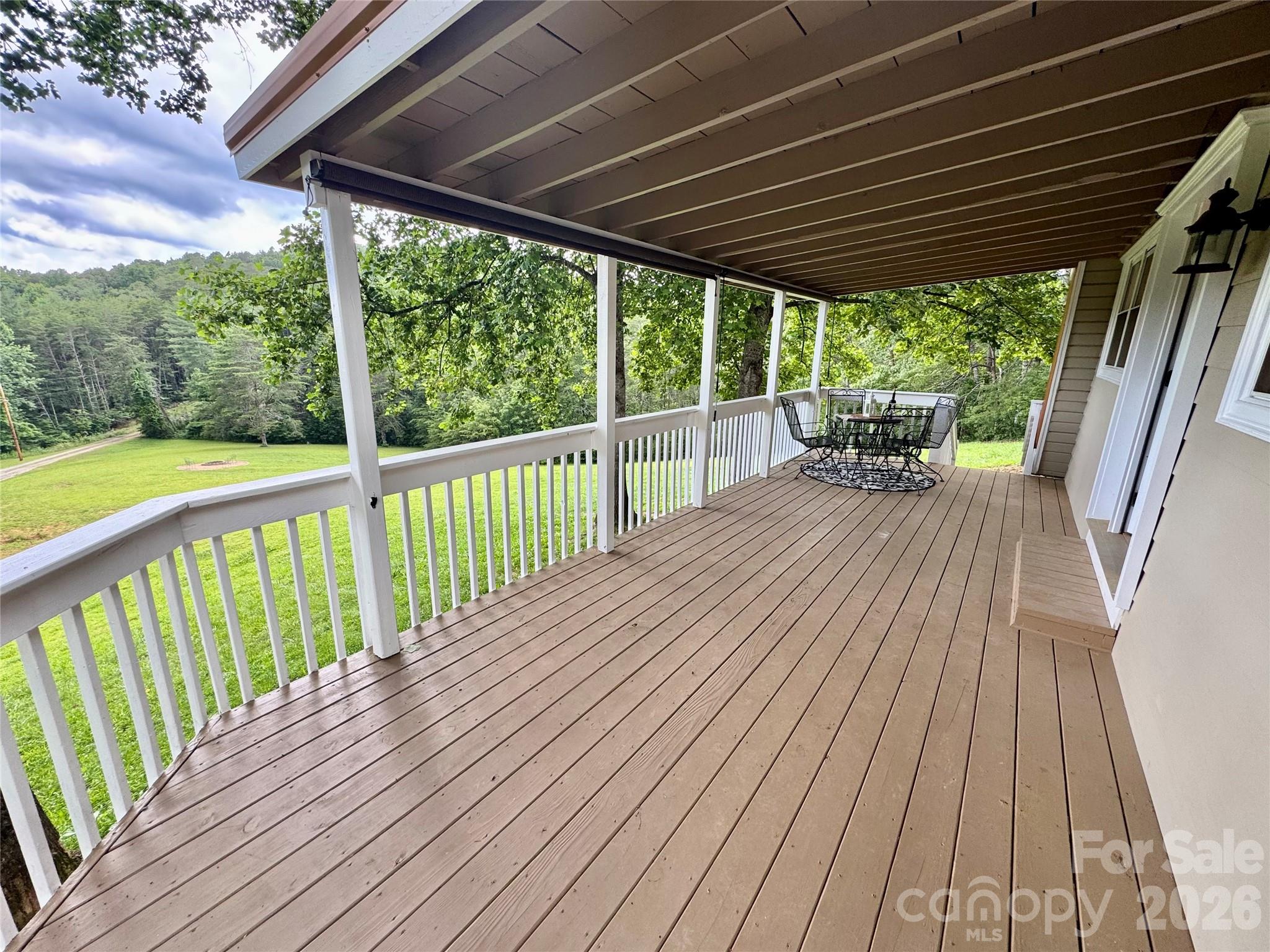 282 Calhoun Trail Rutherfordton, NC 28139 - Photo 7 of 48 a view of a wooden deck with a patio