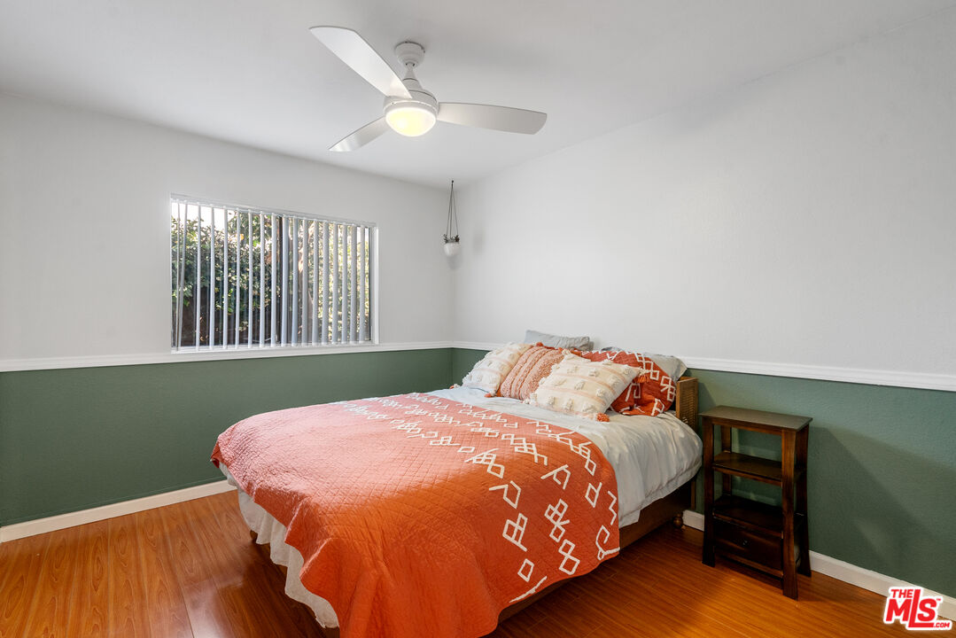 12309 Clover Road Pacoima, CA 91331 - Photo 11 of 15 a bedroom with a bed and a window